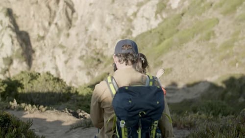 Family Descending Steep Mountain Slope Hiking on Vacation