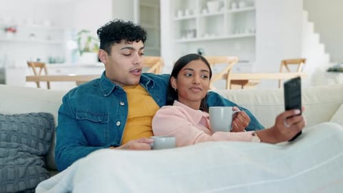 Relaxing Couple Watching Television in Home
