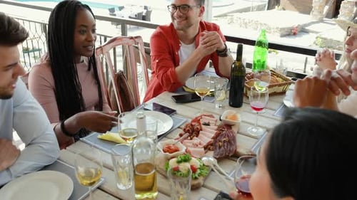 Friends Gather at Table for Lunch