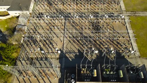 Aerial View of an Electric Substation and Power Plant Grid, Sunny