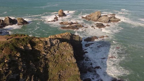 Jagged Rock Pillars Emerging From The Waters At The Coastline Near Loiba, A Coruna In Galicia, Spain