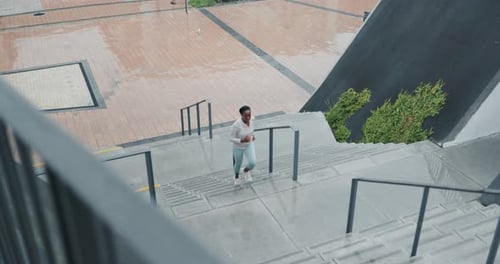 Fitness, stairs and woman training from above in city for sports, cardio or running challenge