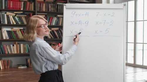 Online Education by Female Teacher at School Library Interior. Intelligent Woman Writing