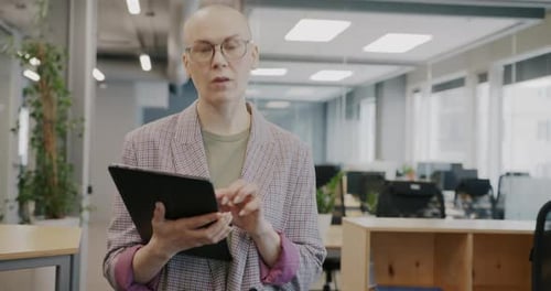 Dolly Shot of Determined Business Lady Walking in Shared Office Using Tablet Touching Screen