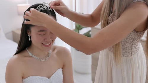 Elegant Bride Receiving Tiara from a Friend