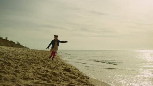 Joyful Kid Running on Sunny Beach