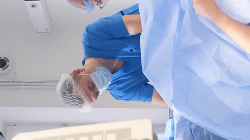 A Team of Surgeons During an Operation to Remove Leg Veins Using Surgical Laparoscopy Instruments