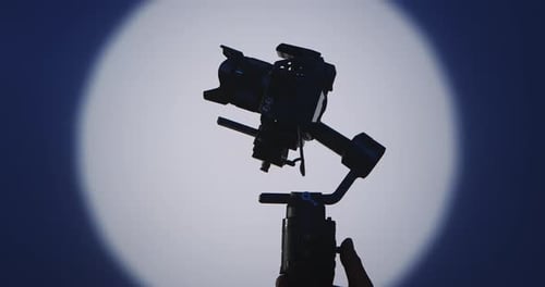 Camera and Gimbal Smoothly Panning in Front of Light