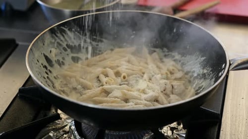 Cooking pasta in a creamy sauce