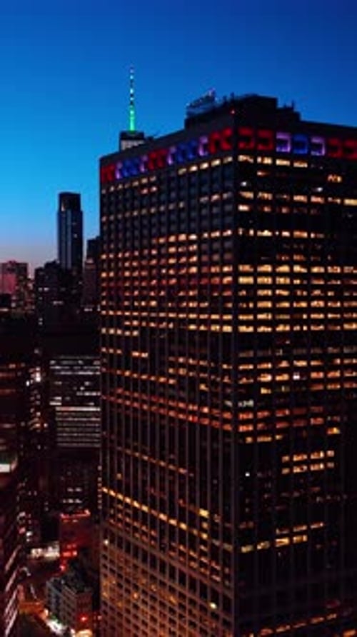 Manhattan street with night lights. Nightlife of New York city aerial view. Vertical video