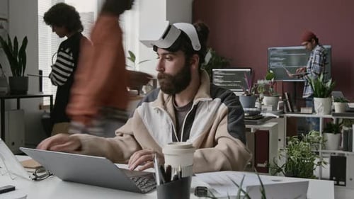 Timelapse of Male Developer Working on Virtual Reality Project at IT Startup