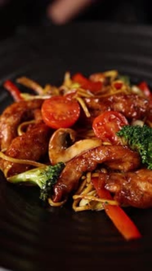 Delicious Asian Noodles with Chicken on Plate