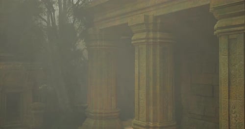 Misty Ruins of an Ancient Temple Surrounded By Tall Trees at Dawn