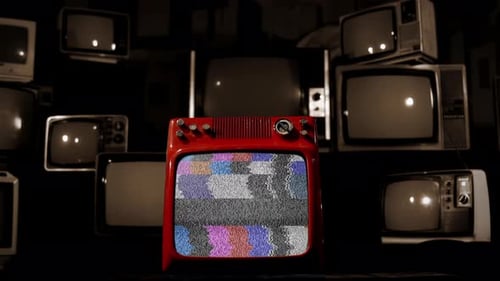 Old Television Turning On Green Screen Among Many Retro TVs Fading to Black. 4K.