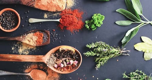 Vegetables, spoon and spices on table top for cooking, turmeric or paprika flavor