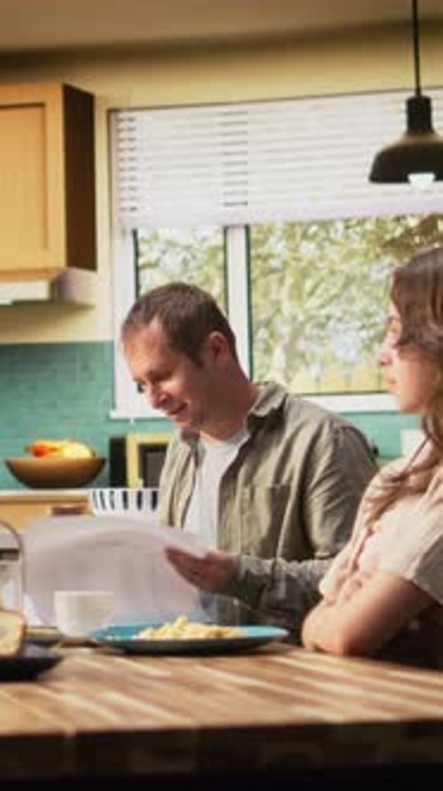 Vertical Video Distracted Busy Father Studying Some Papers During Breakfast Meal