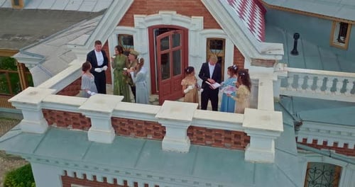 Noblemen are Standing on the Balcony of an Old House a Beautiful View of the Mansion