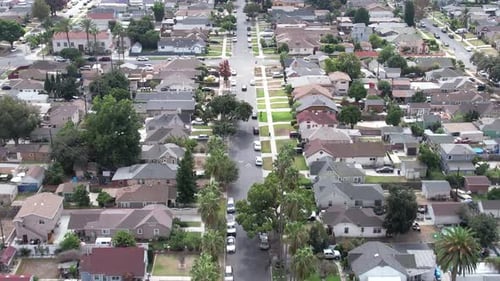 Aerial View Flying Over Crenshaw Neighborhood Street and Homes, South Los Angeles, California