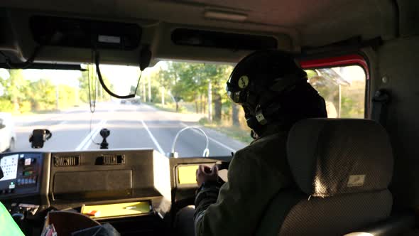 Young Male Firefighter in Uniform Riding on a Big Truck to Place of ...
