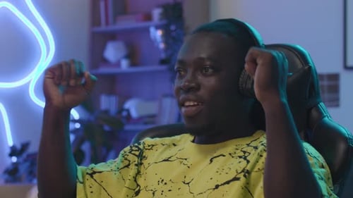 Excited Young Adult Playing Video Game