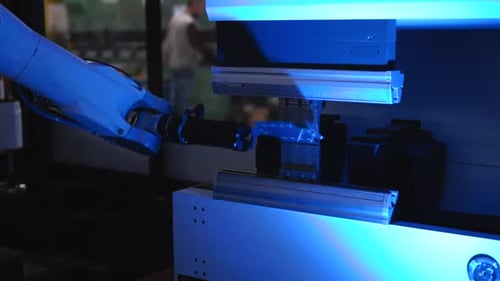 Robotic cnc arm moving a sheet of metal and doing two bends