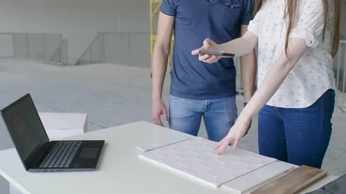 Young Entrepreneurs Discussing Swatches in New Office Space Adult