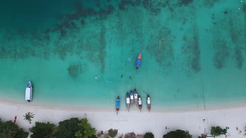 Coast with Parked Boats By Beach Gondolas Sail Away From Beach Top View Right From Above Aerial