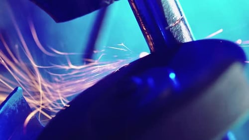 Professional Worker Works in Production with Metal