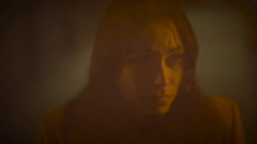 Sad Woman Thinking Hopeless and Lonely Inside Urban Hallway at Night Light