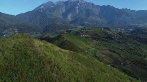 Beautiful Drone shot of the fields of Kundasnag showing Mount Kinabalu in the background Sabah Malay