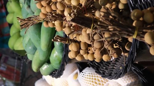 Closeup of Woman Buying Lychee Tropical Fruit