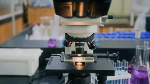 Close-up of Optical Lens of Microscope in Science Laboratory