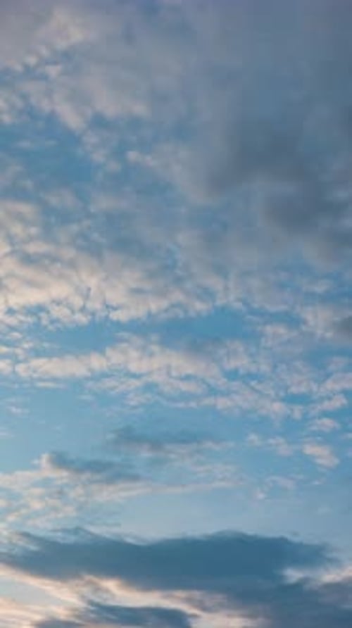 Twilight and dawn sky with cumulus cloud vertical time lapse in an evening.
