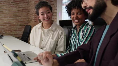 Diverse Team Works Together in Urban Office Space