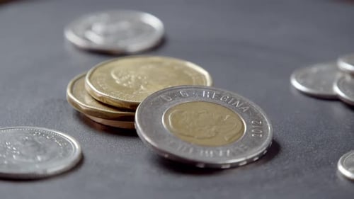 Canadian Currency Coins Rotate in a Circle Stack of Coins and Growing Business