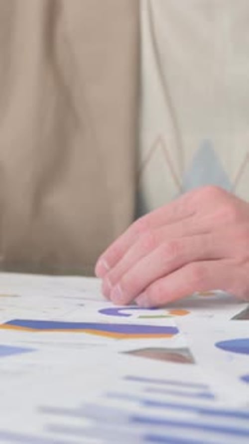 Hands of Business People Doing Paperwork, vertical video