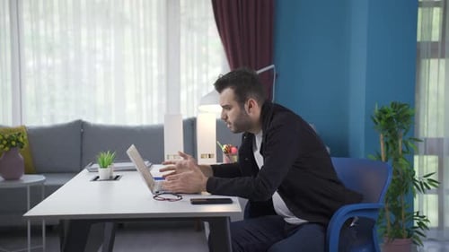 Freelance businessman seeing his failure on laptop.