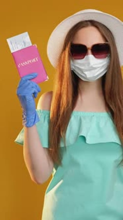 Woman with Passport Wearing Mask Ready to Travel