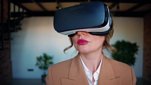 Woman using a Virtual Reality headset in an office