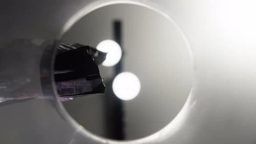 Pouring Trail Mix into a Clear Container