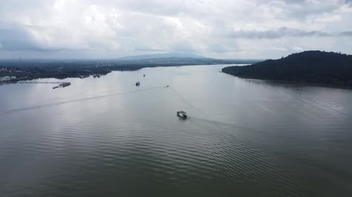 Ferries carry passengers sailing on the Kalimantan sea