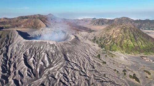 Amazing volcanic landscape of East Java, Indonesia. Drone view of smoke going from the crater.