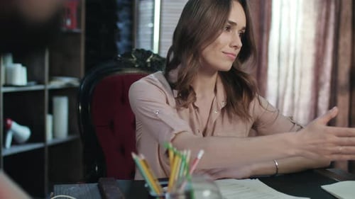 Business Woman Talking with Business Partner During Meeting in Startup Office. Close