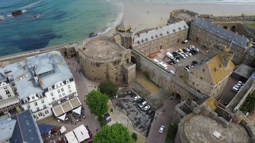 Saint-Malo city and medieval fortified castle, Brittany in France. Aerial top-down circling