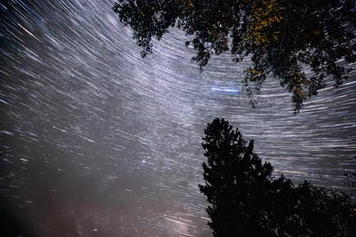 Rotating Star Trails Under a Night Sky