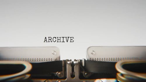 Old mechanical typewriter typing Archive Record No. 24 in a close-up view.