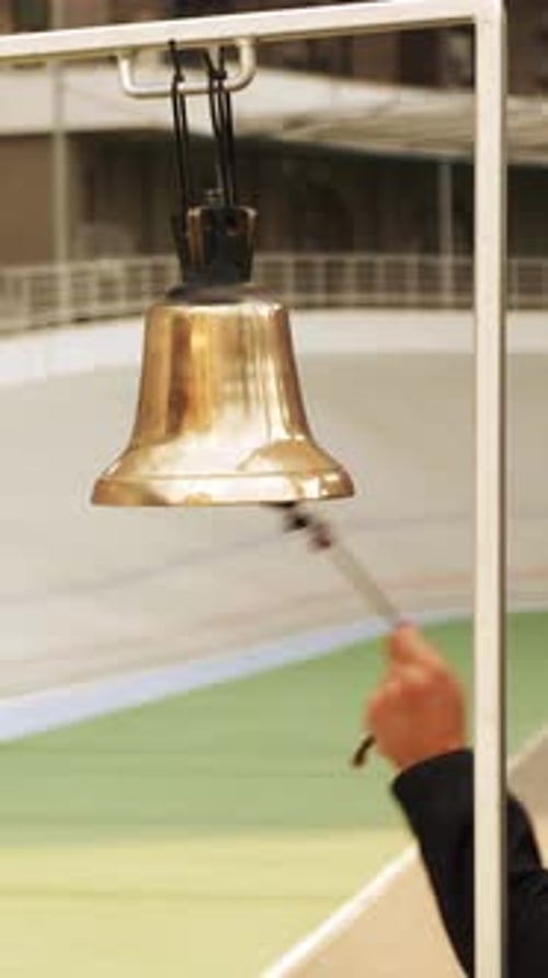 Ringing on bell on cycling track.