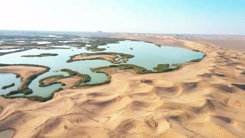 Cinematic Desert Landscape with Sand and Water – 4K Drone Video