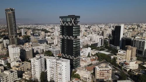 Aerial view of the evening city from above. High-rise building and urban development.