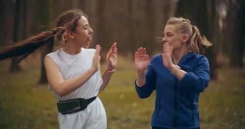 Two Woman Workout Exercising In Park Jogging Fitness